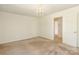 Neutral bedroom provides access to other rooms at 1928 Providence Rd, Charlotte, NC 28211