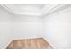 Walk-in closet provides ample storage with neutral carpet and built-in shelving at 1928 Providence Rd, Charlotte, NC 28211