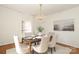 Dining room featuring chandelier lighting and seating for six at 1928 Providence Rd, Charlotte, NC 28211