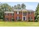 Beautiful red brick house with black shutters and well-kept lawn at 1928 Providence Rd, Charlotte, NC 28211