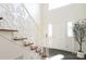 Elegant foyer featuring staircase with decorative white railing at 1928 Providence Rd, Charlotte, NC 28211