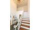 Grand foyer featuring a staircase with white railing and dark stone floors at 1928 Providence Rd, Charlotte, NC 28211