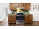 Kitchen with wood cabinets, stainless steel appliances, and a green countertop at 1928 Providence Rd, Charlotte, NC 28211