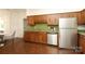 The kitchen includes stainless steel appliances and wood cabinets with green countertops at 1928 Providence Rd, Charlotte, NC 28211