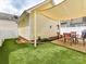 Private backyard featuring artificial turf and patio area for outdoor living, offering a low-maintenance space at 2003 Trigger Dr, Indian Trail, NC 28079