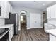 Spacious kitchen with modern appliances, white cabinets, and hardwood floors at 2003 Trigger Dr, Indian Trail, NC 28079