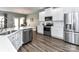 Well-equipped kitchen with stainless steel appliances, white cabinetry, and ample countertop space at 2003 Trigger Dr, Indian Trail, NC 28079