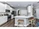 Bright kitchen with white cabinets, stainless steel appliances, and a quartz countertop at 2003 Trigger Dr, Indian Trail, NC 28079