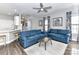 Open-concept living room with hardwood floors, barstool seating, and access to the kitchen at 2003 Trigger Dr, Indian Trail, NC 28079