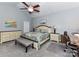 Spacious main bedroom with a ceiling fan, neutral walls, and ample natural light at 2003 Trigger Dr, Indian Trail, NC 28079
