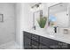 Bright bathroom features dual vanity with modern fixtures and sleek countertop at 207 Knot St, Shelby, NC 28150