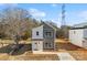 New construction features a modern two-tone exterior with a clean, contemporary design on a sunny day at 207 Knot St, Shelby, NC 28150
