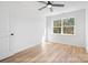 Light filled bedroom features a ceiling fan and a large window at 213 Knot St, Shelby, NC 28150