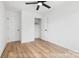 Clean bedroom features ceiling fan, wood-look flooring, and a spacious closet at 213 Knot St, Shelby, NC 28150