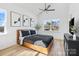 Bright bedroom featuring vaulted ceilings, modern decor, and a large window with a serene view at 213 Knot St, Shelby, NC 28150