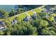 An aerial view of the lakefront property, showcasing the home, surrounding trees, and lake access at 230 Washam Rd, Mooresville, NC 28117