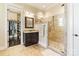 Modern bathroom with walk-in shower, dual vanities, granite countertops and access to walk-in closet at 230 Washam Rd, Mooresville, NC 28117