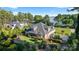 Beautiful home featuring a screened-in porch, lakeside access, and meticulously landscaped grounds at 230 Washam Rd, Mooresville, NC 28117