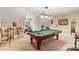 Spacious game room featuring a pool table, with unique light fixture and drum set at 230 Washam Rd, Mooresville, NC 28117