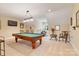 Spacious game room with a pool table, drum set, and comfortable seating area at 230 Washam Rd, Mooresville, NC 28117