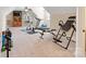 Well-equipped home gym with treadmill, exercise bike, and weightlifting equipment at 230 Washam Rd, Mooresville, NC 28117