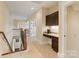 Upstairs hallway with built-in desk and cabinetry, carpeted floors, and views of the staircase at 230 Washam Rd, Mooresville, NC 28117