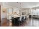 Island kitchen with granite countertops, stainless appliances, and hardwood flooring at 230 Washam Rd, Mooresville, NC 28117