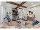 Bright living room with stone fireplace, beamed ceiling and hardwood floors at 230 Washam Rd, Mooresville, NC 28117