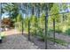 Fenced side yard with mulched path and landscape at 230 Washam Rd, Mooresville, NC 28117