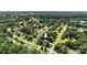 Aerial view shows home is nestled among mature trees on a corner lot with well-maintained landscaping at 2367 24Th Street Ne Ln, Hickory, NC 28601