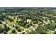 Aerial view shows home is nestled among mature trees on a corner lot with well-maintained landscaping at 2367 24Th Street Ne Ln, Hickory, NC 28601