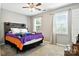 Charming bedroom features a wood headboard, two windows with blinds and curtains at 2367 24Th Street Ne Ln, Hickory, NC 28601