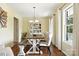 Bright dining room with wood table, hutch, chandelier, and natural lighting at 2367 24Th Street Ne Ln, Hickory, NC 28601