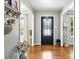 Inviting foyer features hardwood floors and an elegant stained-glass front door at 2367 24Th Street Ne Ln, Hickory, NC 28601