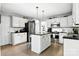 Kitchen with a central island, stainless steel appliances and white cabinetry at 2367 24Th Street Ne Ln, Hickory, NC 28601
