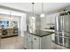 Kitchen with stainless steel refrigerator, center island and bright lighting at 2367 24Th Street Ne Ln, Hickory, NC 28601