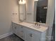 Bright bathroom featuring a double sink vanity with white cabinetry and shower with dark gray tiling at 259 Luray Way # 443, Rock Hill, SC 29730