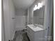 Bright bathroom showcasing tile flooring, white cabinets, a single vanity, and a tub with a shower at 259 Luray Way # 443, Rock Hill, SC 29730