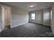 Bedroom with plush carpeting, neutral walls, trim work, and two entry doors at 259 Luray Way # 443, Rock Hill, SC 29730