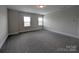Spacious bedroom with plush carpeting, neutral paint, and abundant natural light from two windows at 259 Luray Way # 443, Rock Hill, SC 29730