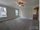 Large bedroom features neutral walls, plush carpeting, and a lighted ceiling fan at 259 Luray Way # 443, Rock Hill, SC 29730