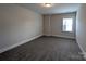 Bedroom featuring neutral color scheme, plush carpeting, base trim, and window with bright natural light at 259 Luray Way # 443, Rock Hill, SC 29730