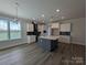 Kitchen area featuring an island, eat in area, white cabinets, and stainless steel appliances at 259 Luray Way # 443, Rock Hill, SC 29730