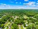 Sweeping aerial view capturing the property's location, surrounded by lush greenery and residential charm at 2919 Dunaire Dr, Charlotte, NC 28205
