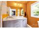 Bright bathroom with double vanity, modern fixtures, and neutral grey cabinets at 2919 Dunaire Dr, Charlotte, NC 28205