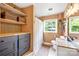 Well-organized bathroom featuring neutral paint colors, custom cabinets, and natural light at 2919 Dunaire Dr, Charlotte, NC 28205