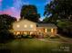 Inviting two-story brick home with a well-manicured lawn and beautiful landscaping creating instant curb appeal at 2919 Dunaire Dr, Charlotte, NC 28205