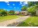 Lovely two-story residence featuring a pristine lawn, brick and siding exterior, and a paved driveway at 2919 Dunaire Dr, Charlotte, NC 28205