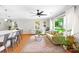 Bright living room featuring hardwood floors, a large window, comfortable seating, and natural light at 2919 Dunaire Dr, Charlotte, NC 28205