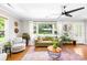 Bright living room with hardwood floors, large windows, comfortable seating, and stylish decor at 2919 Dunaire Dr, Charlotte, NC 28205